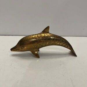 Vintage brass dolphin decor with pattern